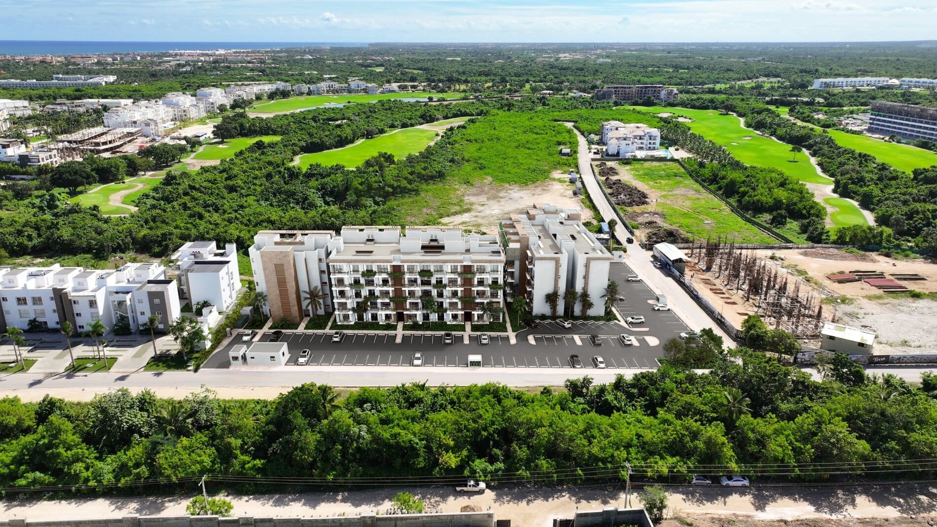 Rendering of the Riviera Bay blocks set into an aerial view of their Cana Bay site — 110 residences, each deeded on delivery, often to buyers signing from abroad.