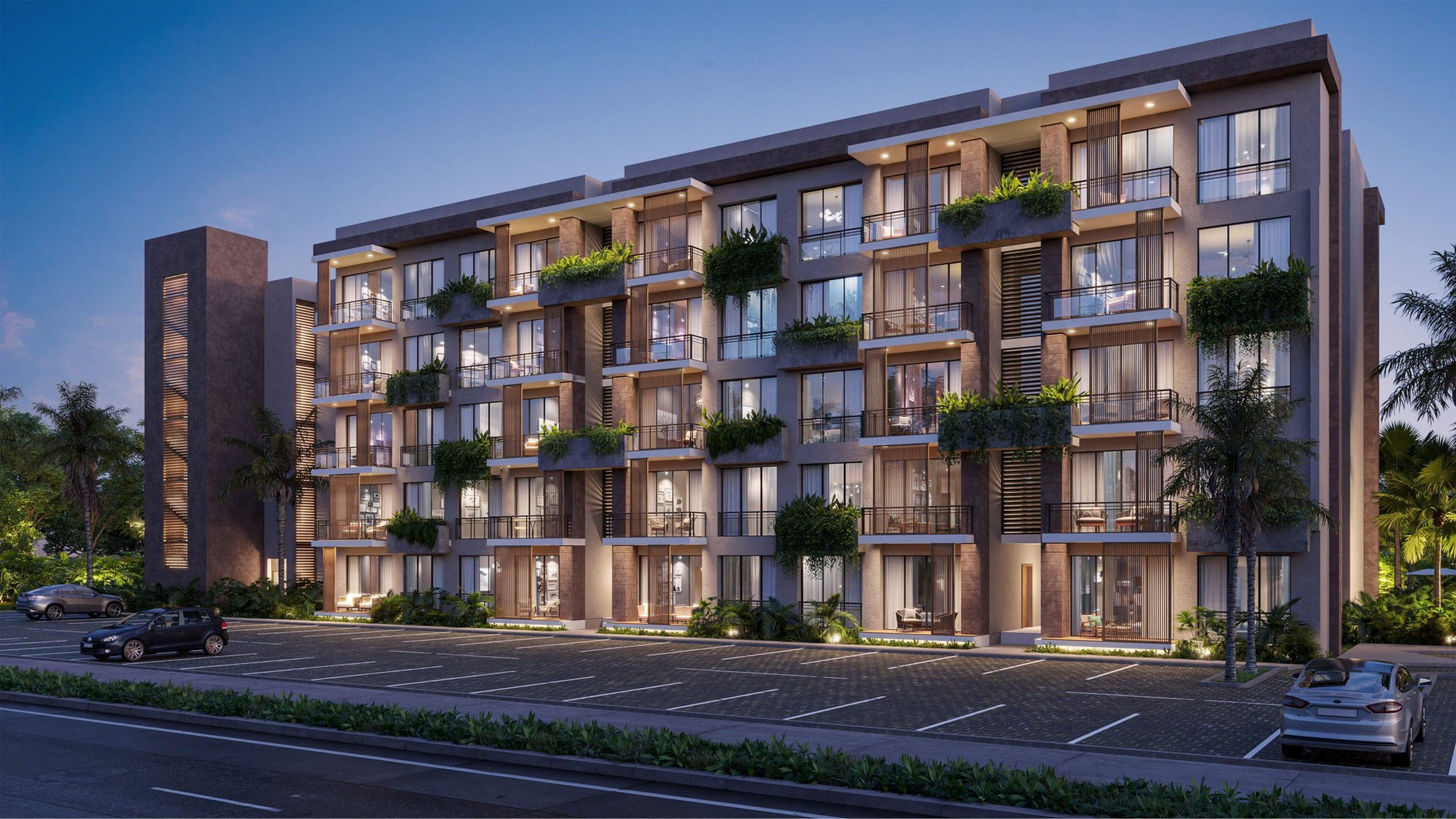 Rendering of Riviera Bay's street frontage at dusk in Cana Bay, lit balconies on one of the blocks that will hold its 110 residences.